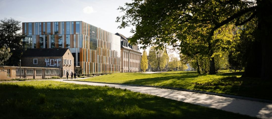 Campus building with green lawns